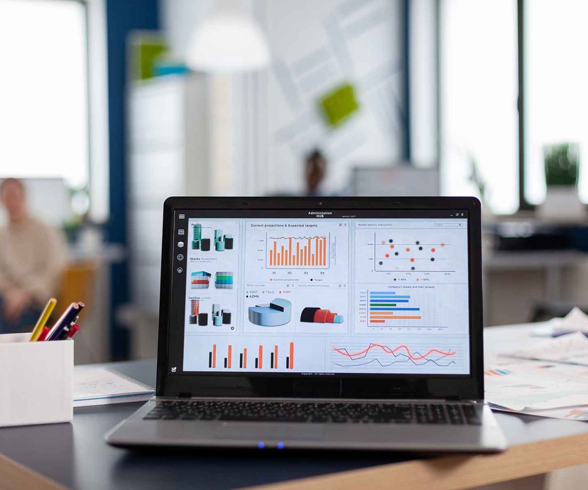 laptop-with-company-financial-charts-on-office-des-LZC785R.jpg laptop-with-company-financial-charts-on-office-des-LZC785R.jpg